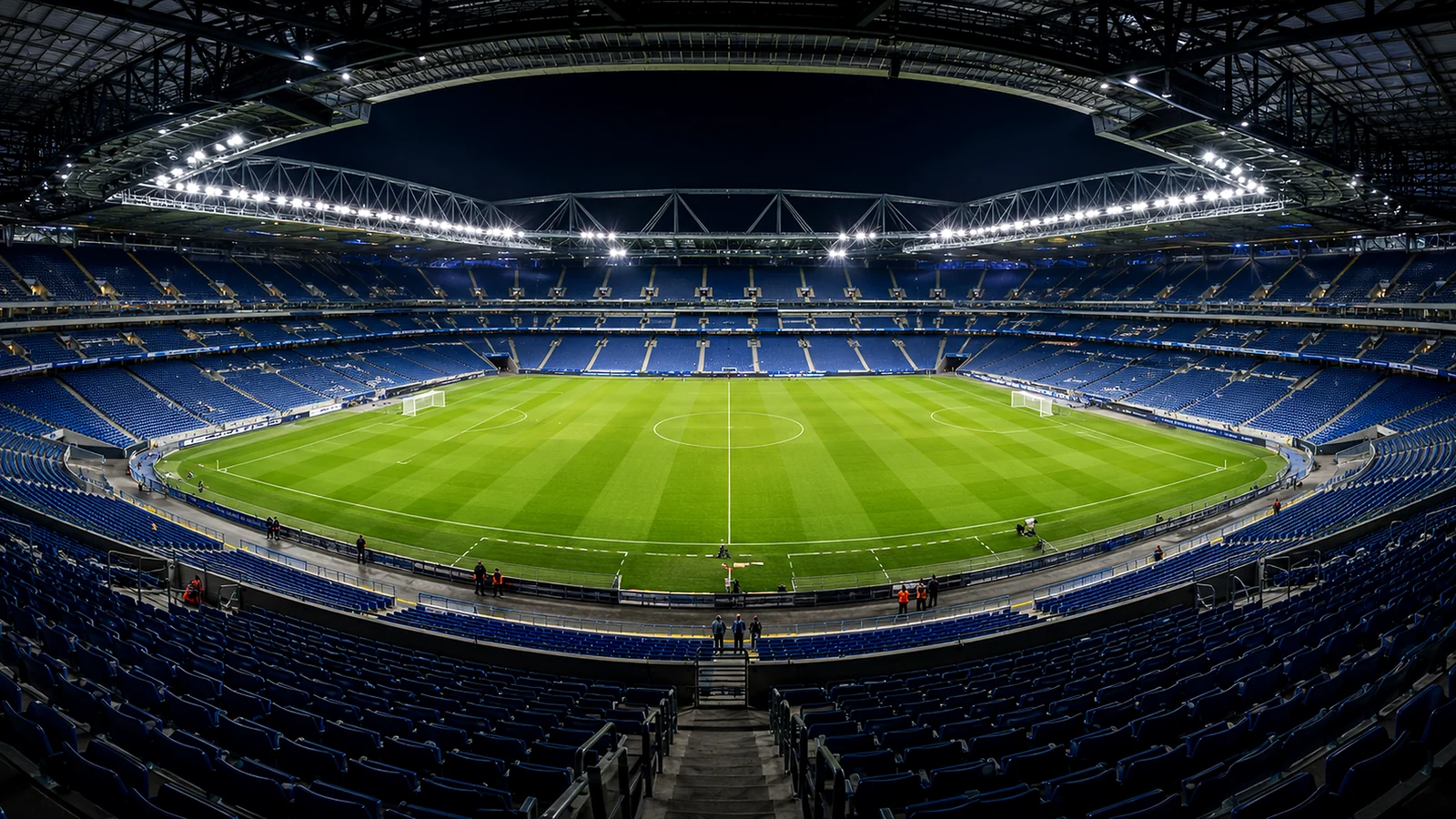 Large professional stadium under operating sports lighting